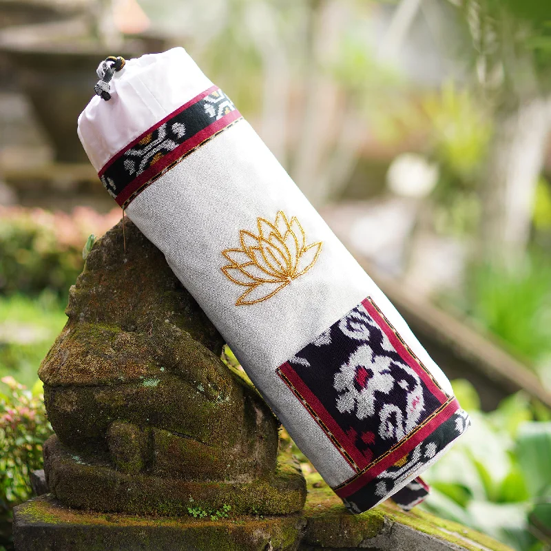 - Organic cotton dog bibsLotus Lagoon in Ivory Javanese Ikat Cotton Yoga Mat Bag
